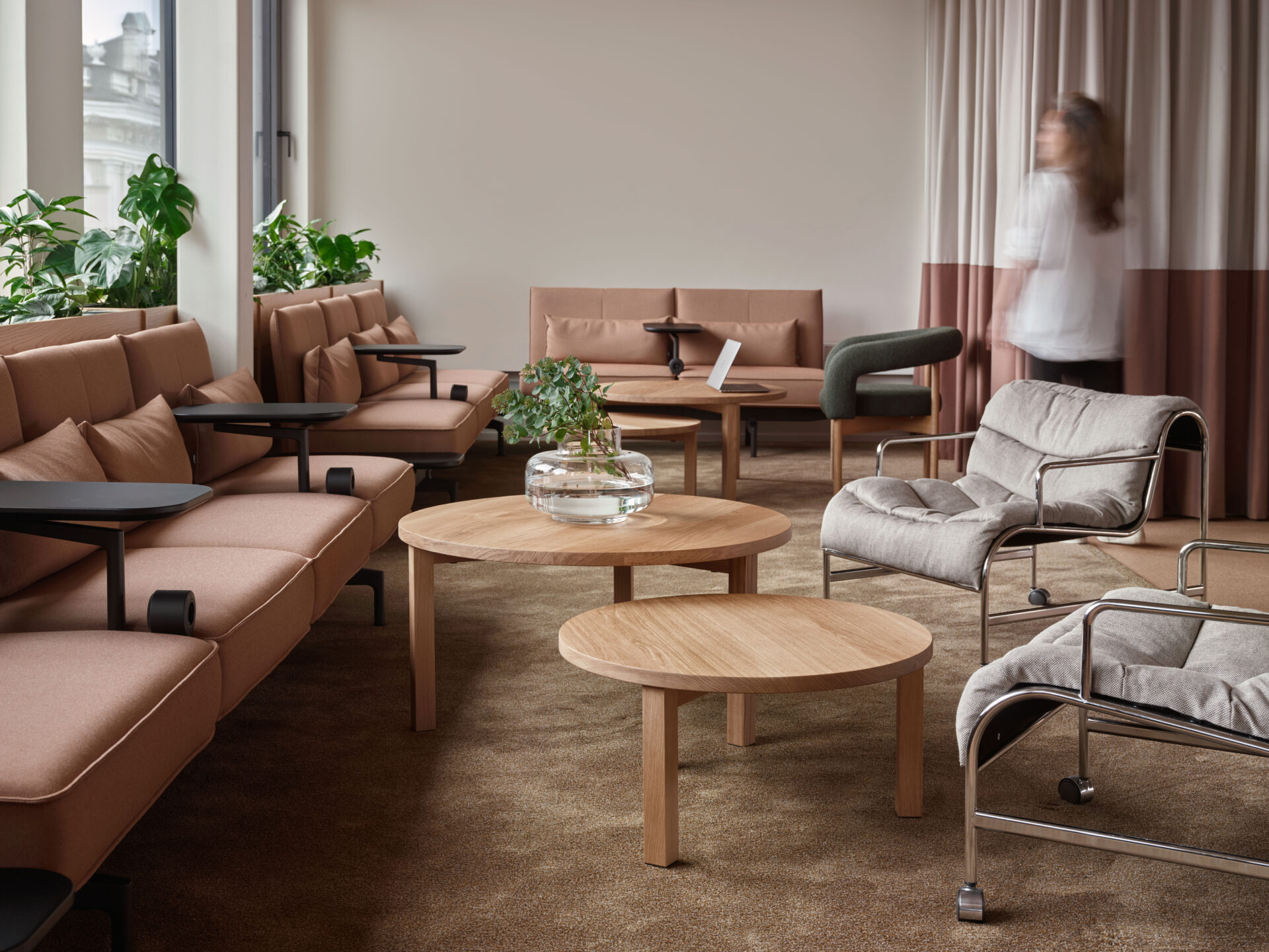 modern office design, pale pink vitra sofas, oak side tables, armchairs with chromed frame