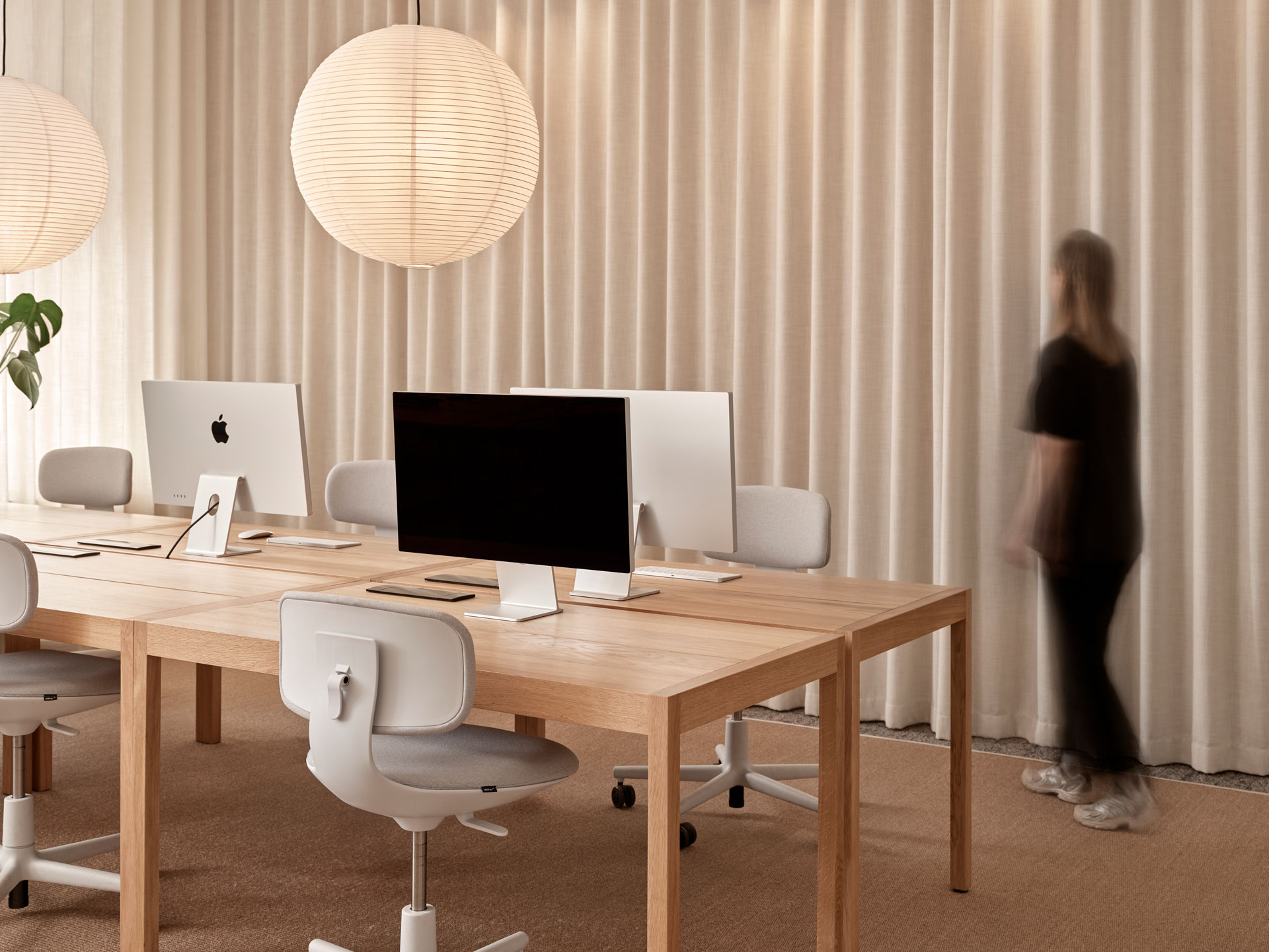 modern office. oak tables, white task chairs with light upholstery