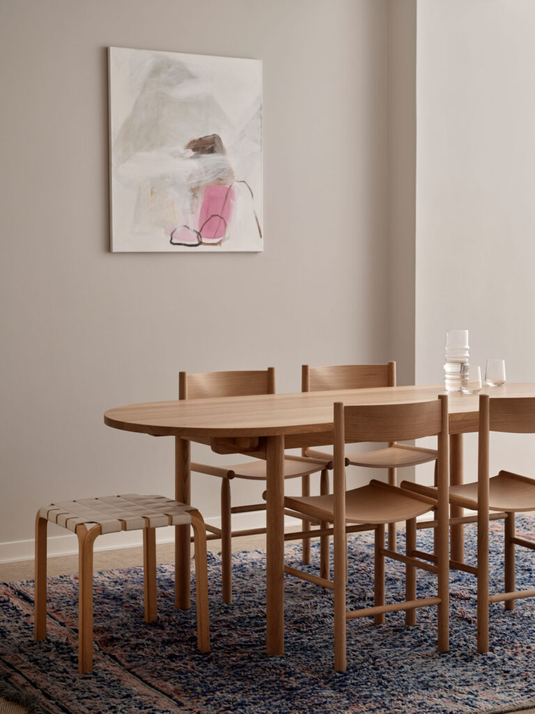 wooden muuto table, wooden chairs, greige walls
